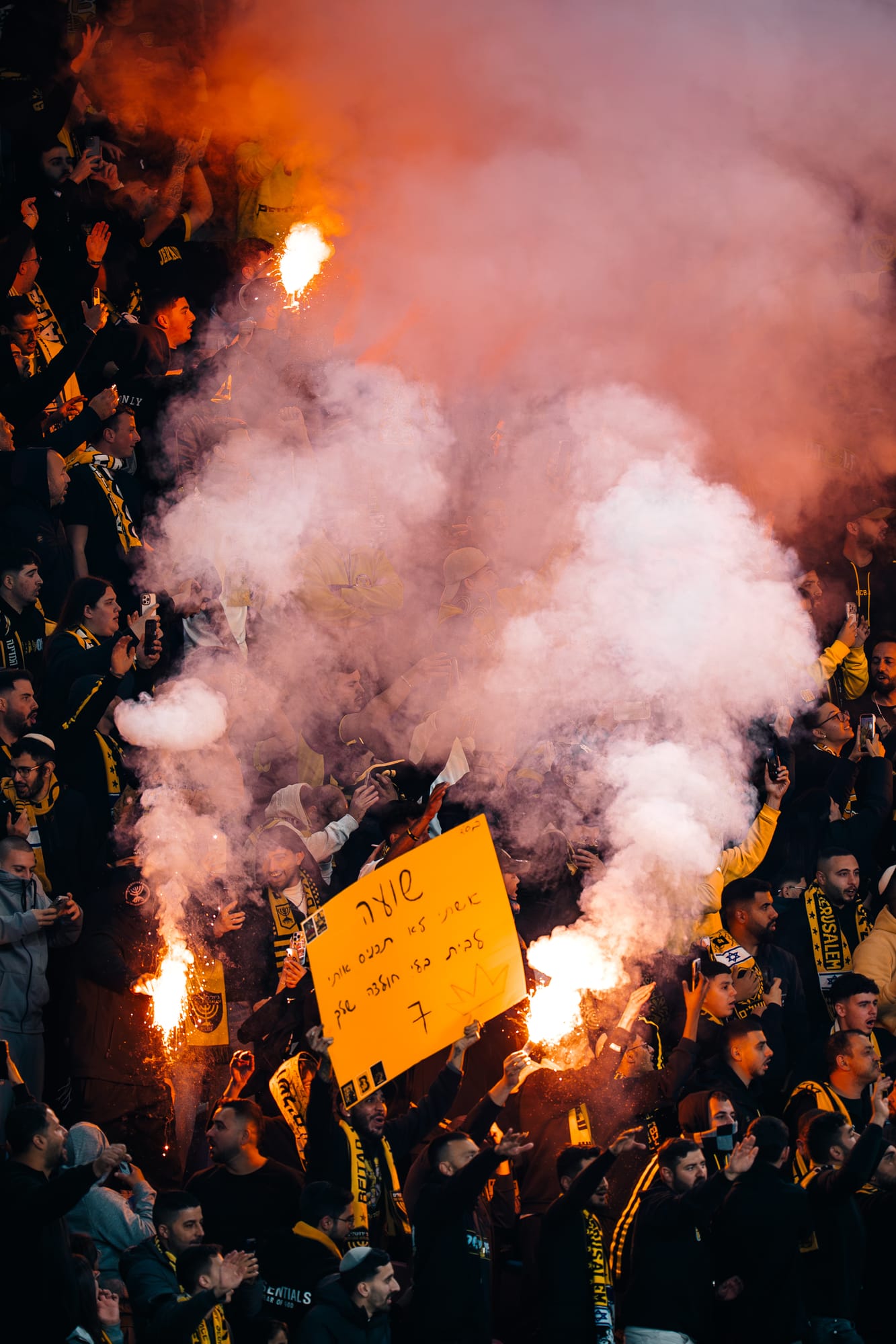 Tifo detail — flags and colour